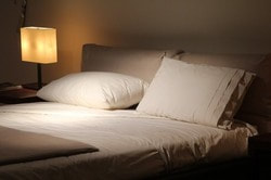Double bed in a dark room