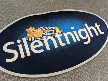 Silentnight logo on bed